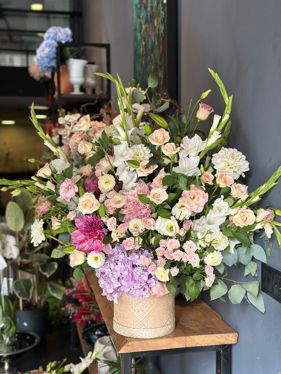 Fresh roses, dahlias and hydrangea being arranged in our Casablanca flower shop